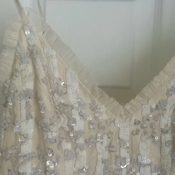 NEEDLE AND THREAD long, sequin gown.
